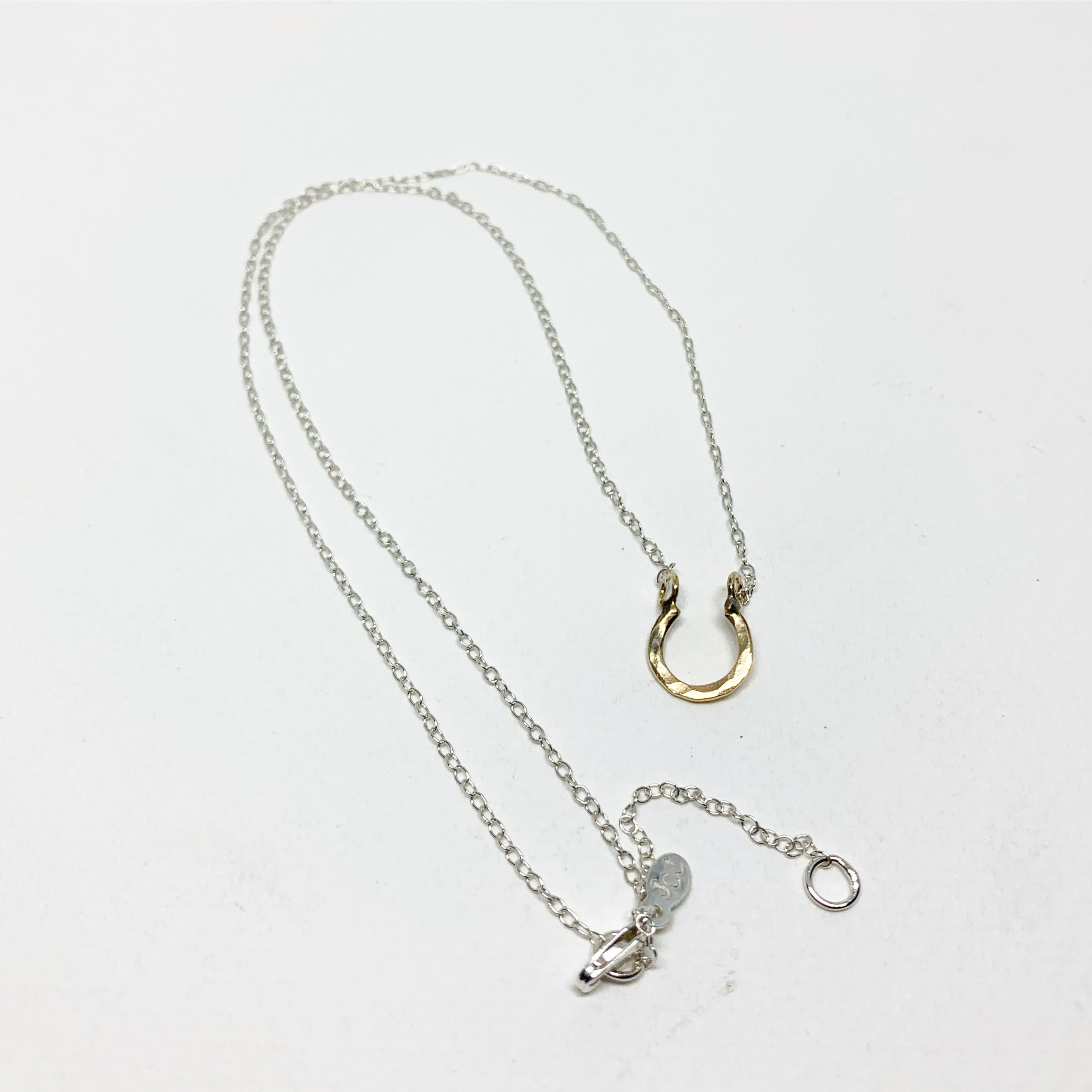 Mini Lucky Horseshoe Charm Necklace by Jennifer Cervelli Jewelry