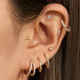 14K Gold & Diamond Twisted Huggie Hoops by eklexic